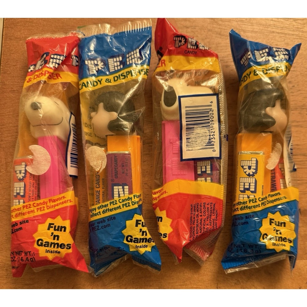 Vintage Peanuts Pez Lot of 4. 2 Snoopy (PINK), and 2 Lucy SEALED NIB‎